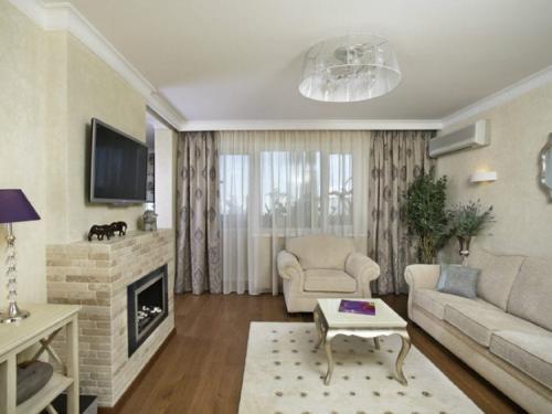 Камин в гостиной дизайн. Дизайн интерьера гостиной с камином